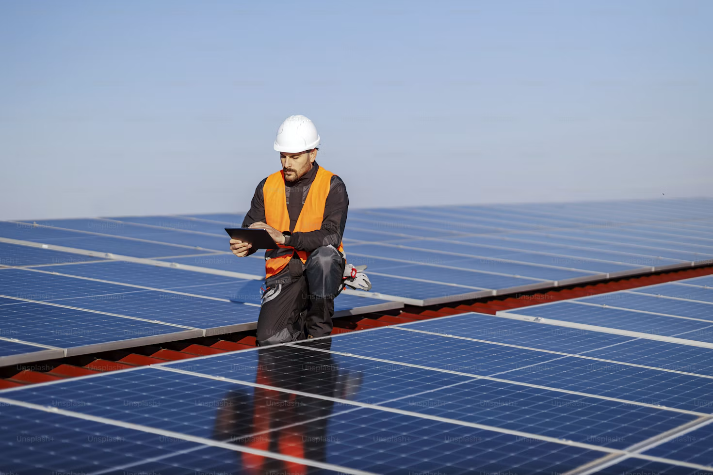 An engineer inspecting a large solar energy installation